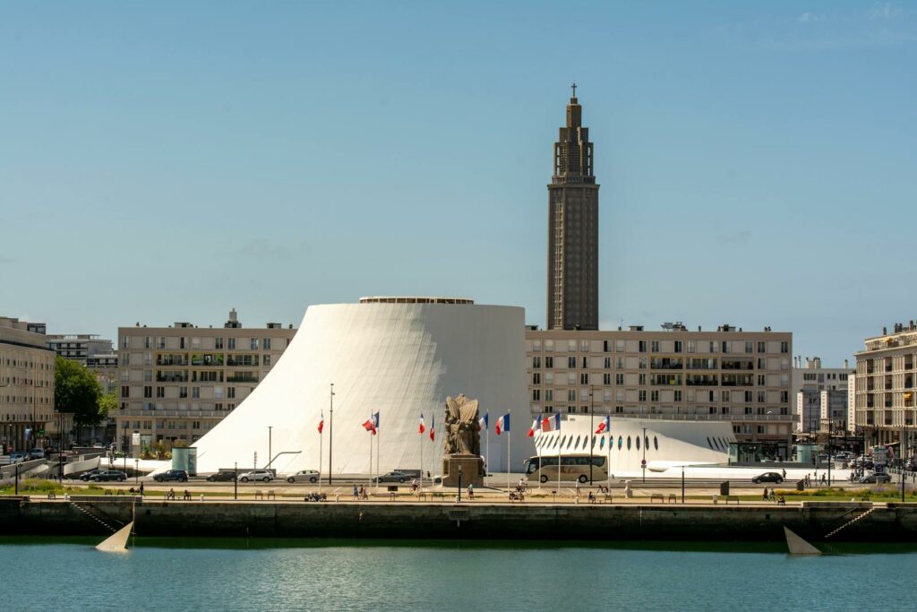Scenic view of Le Havre city with St. Joseph Church tower and iconic architecture.